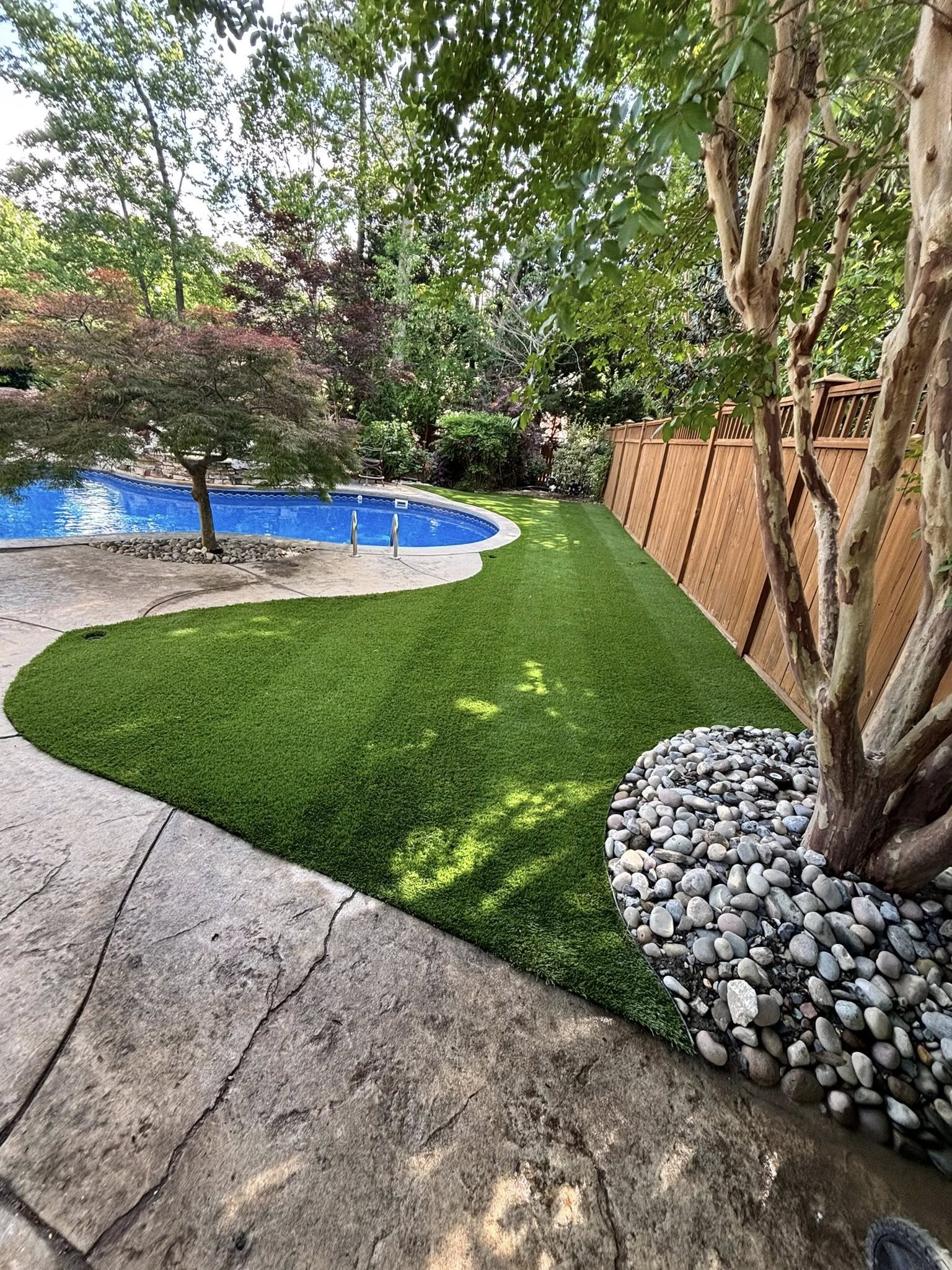 artificial lawns around pool at home